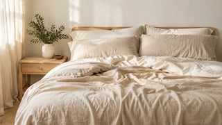 Natural linen bedding on a sunlit bedroom bed